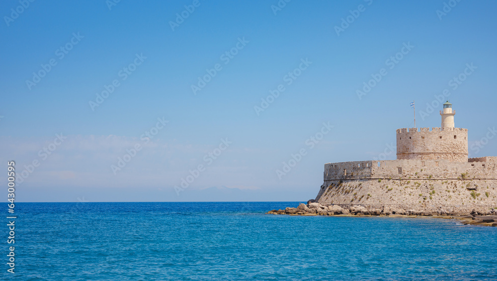 Mandraki port and fort of St. Nicholas. Rhodes, Greece. Hirschkuh statue in the place of the Colossus of Rhodes, Rhodes, Greece travel in summer sunny day