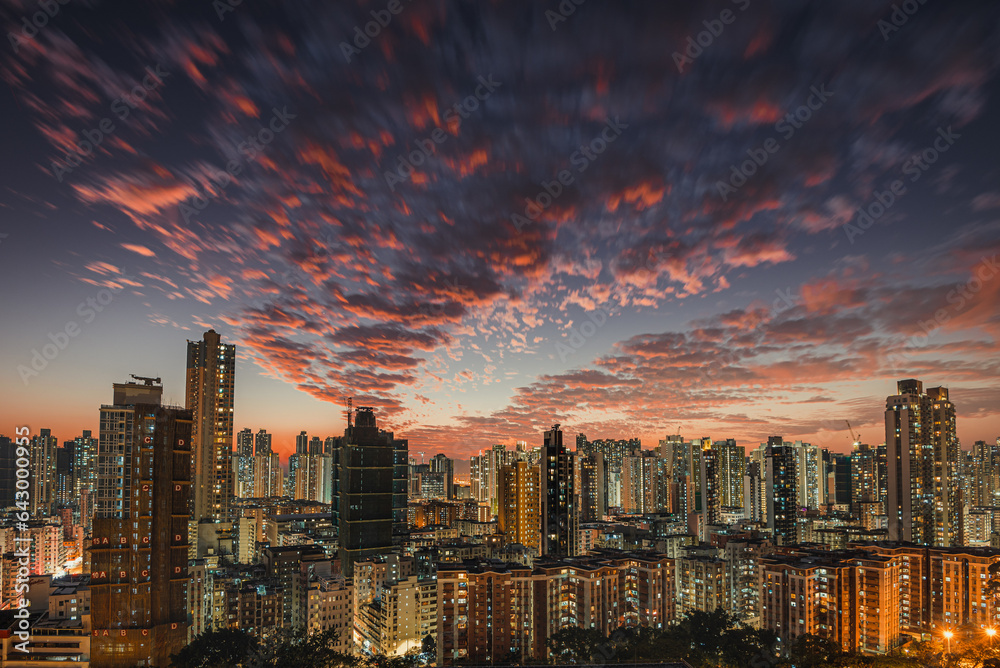 city skyline at night during sunset with colorful cloud and building light on