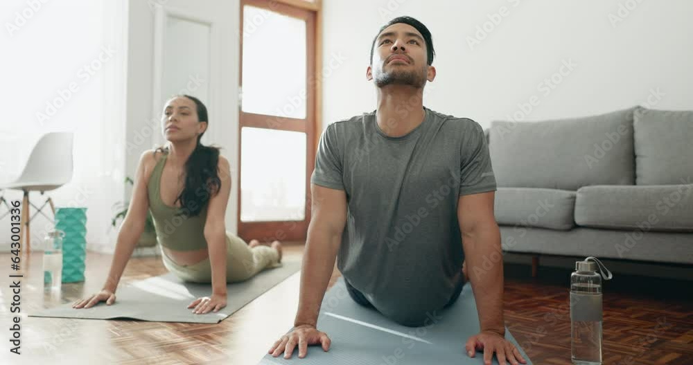 Lounge, meditation and couple with exercise, yoga and training with peace, breathing and workout. Home, calm man and woman with fitness, relax and zen with mental health, wellness and cobra with