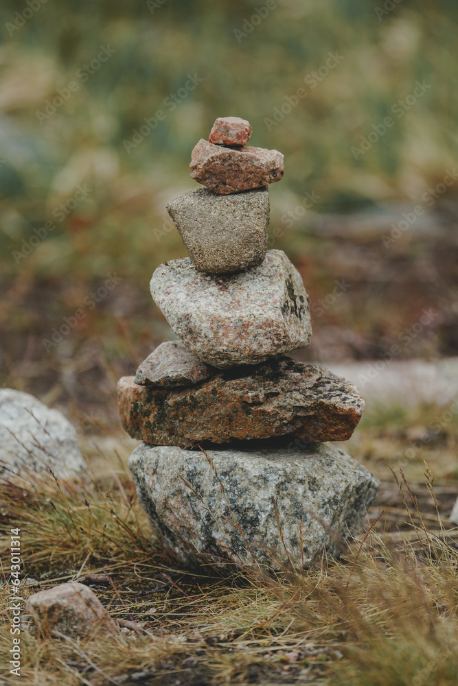 A Zen-style stone pyramid in a natural setting