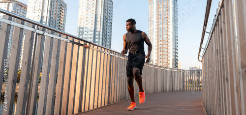 Fotografija Full length of confident African athlete in sportswear enjoying the morning jog