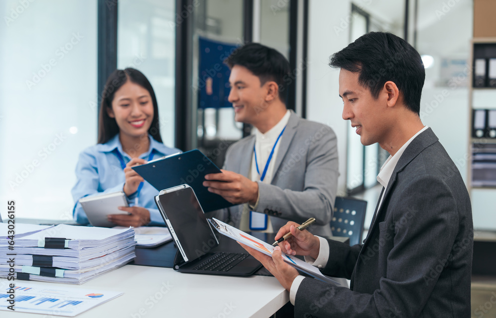 Asian business people teamwork strategy corporate meeting in progress, brainstorming ideas, leadership decision-making executives in conference boardroom, productive people engaged in problem-solving