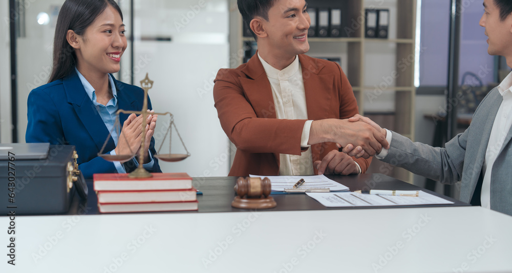 © Phushutter - handshake of Legal consultation, asian lawyers team meeting post-contract, contract finalization, lawyers discussing agreements, agreement assessment, legal experts in conversation