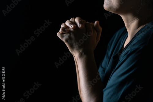 Christian life crisis prayer to god. Woman Pray for god blessing to wishing have a better life. woman hands praying to god with the bible. begging for forgiveness and believe in goodness.