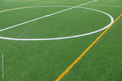 Detail of the center of an artificial grass 7-a-side football field.
