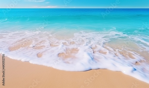 Beautiful tropical wave of summer sea surf. Soft turquoise blue ocean wave on the golden sandy beach.