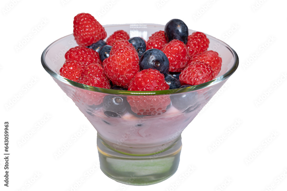 Fresh wild berry fruit on top of fruit yogurt in jar Fresh wild berry fruit on top of fruit yogurt in jar