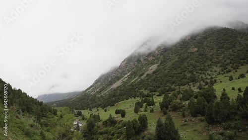 mountains of kyrgyzstan, alamudun gorge, clouds in the mountains photo