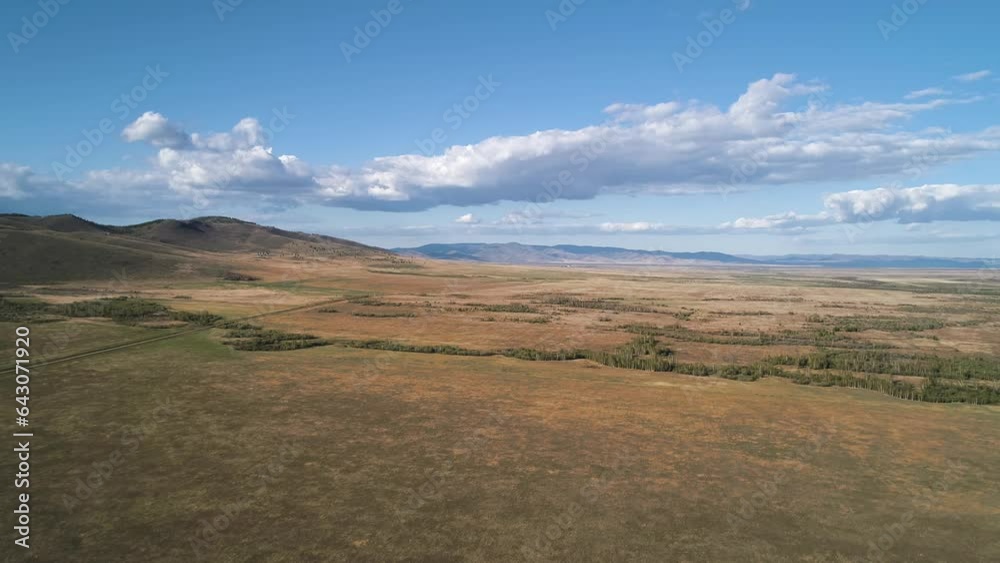 Aerial panoramic view of a steppe hills against blue sky. Majestic nature Aerial panoramic view of a steppe hills against blue sky. Majestic nature