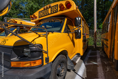 Front of a parked yellow school bus.