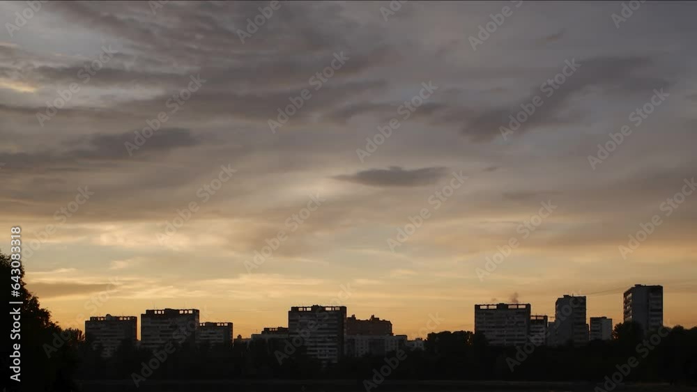 Panorama of sunset sky over modern blocks of flats in a city. 4k video. Panorama of sunset sky over modern blocks of flats in a city. 4k video.