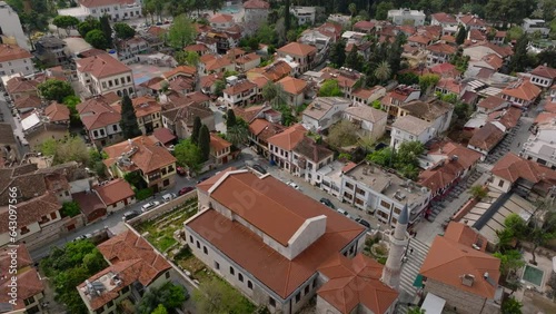 High angle view of Sehzade Korkut Mosque. Muslim building with minaret surrounded by houses in residential area. Antalya, Turkey photo
