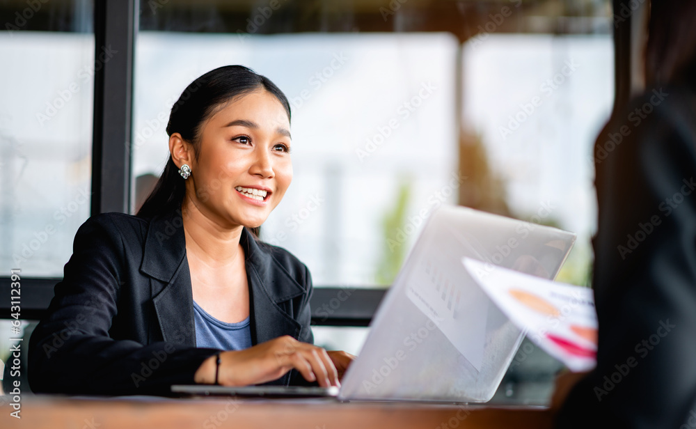 young business woman working intently and have a bright smile Meeting of the work plan financial planner finance staff happy work Financial and investment planner young business woman working intently and have a bright smile Meeting of the work plan financial planner finance staff happy work Financial and investment planner