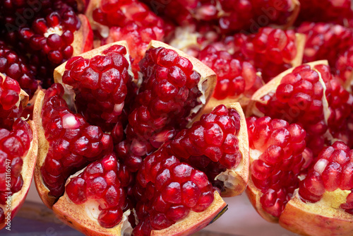 A pomegranate has been peeled to reveal the bright red interior that is delicious to eat. There are many types of antioxidants. Relieves heart disease and high blood pressure photo