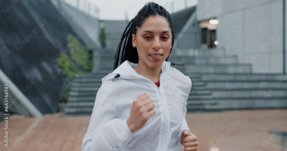 Woman, fitness and running in rain for exercise, cardio workout or outdoor training by stairs. Portrait of female person, athlete or runner in sport motivation, sprint or lose weight in an urban town