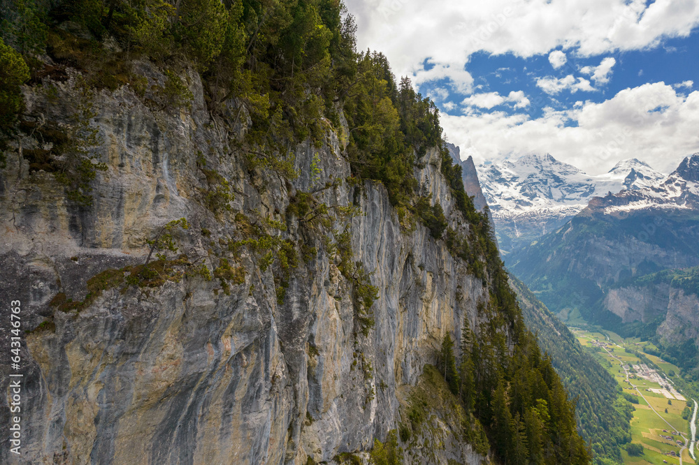 Aerial Drone View of The Swiss Alps with Snow Covered Mountains in the background in Switzerland in Summer Aerial Drone View of The Swiss Alps with Snow Covered Mountains in the background in Switzerland in Summer