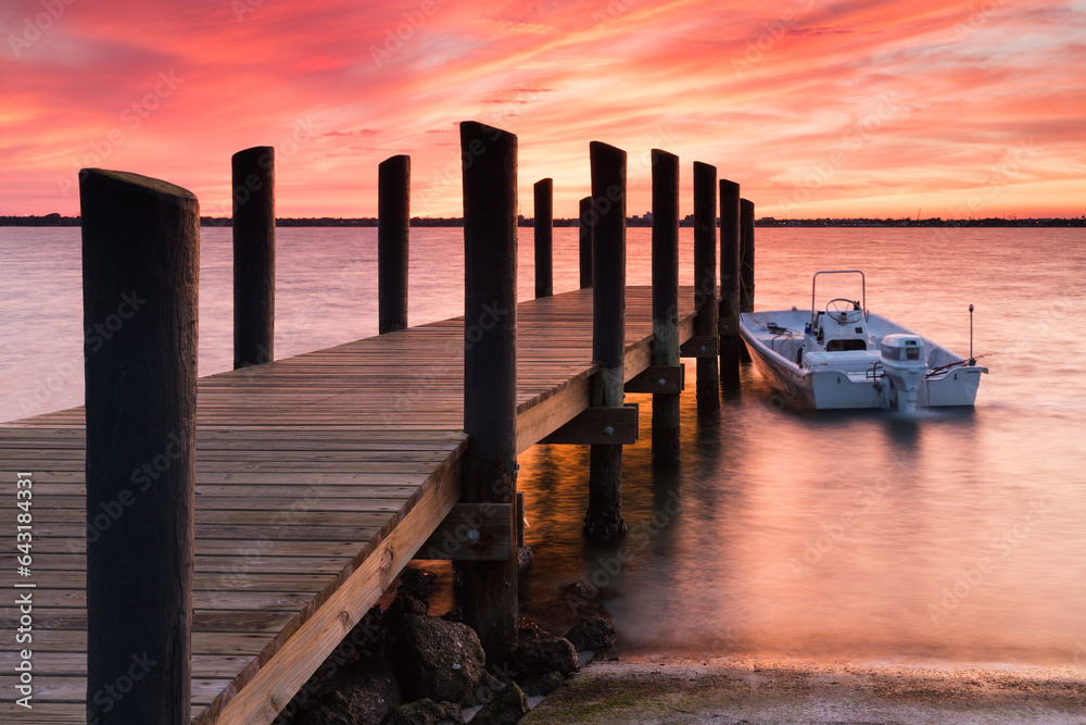 Sunset at a pier, Hutchinson Island, Florida.