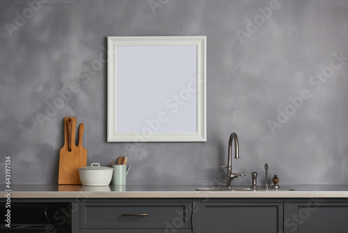Mock up poster frame in kitchen interior on empty grey color wall background. Generative AI © Ibnu