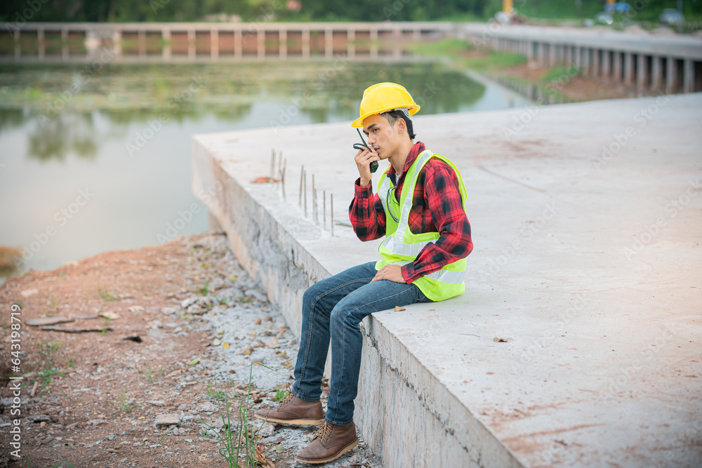 Engineers are talking to work over a walkie-talkie. Engineers are talking to work over a walkie-talkie.