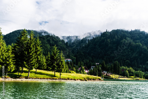 Landscape of Colibita lake, the sea from the mountain. Calimani mountains, Bistrita Nasaud county, Romania. photo