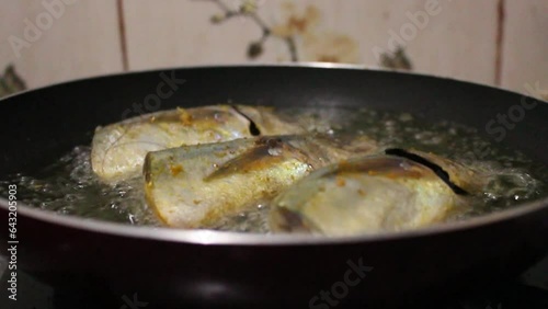 Cooking fish in a flat pan