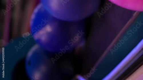 Сlose-up hand taking a bowling ball, vertical