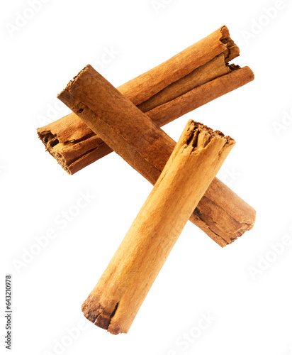 Fototapeta Naklejka Na Ścianę i Meble -  Fresh dried raw Cinnamon stick falling in the air