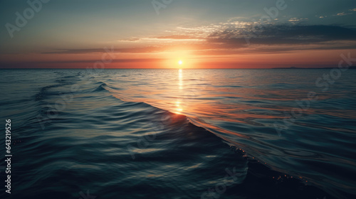 Spectacular abstract image of a scenic calm ocean, sunrise sky reflecting in the water. Sunset and natural.