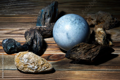 Blue sphere on a wooden background.