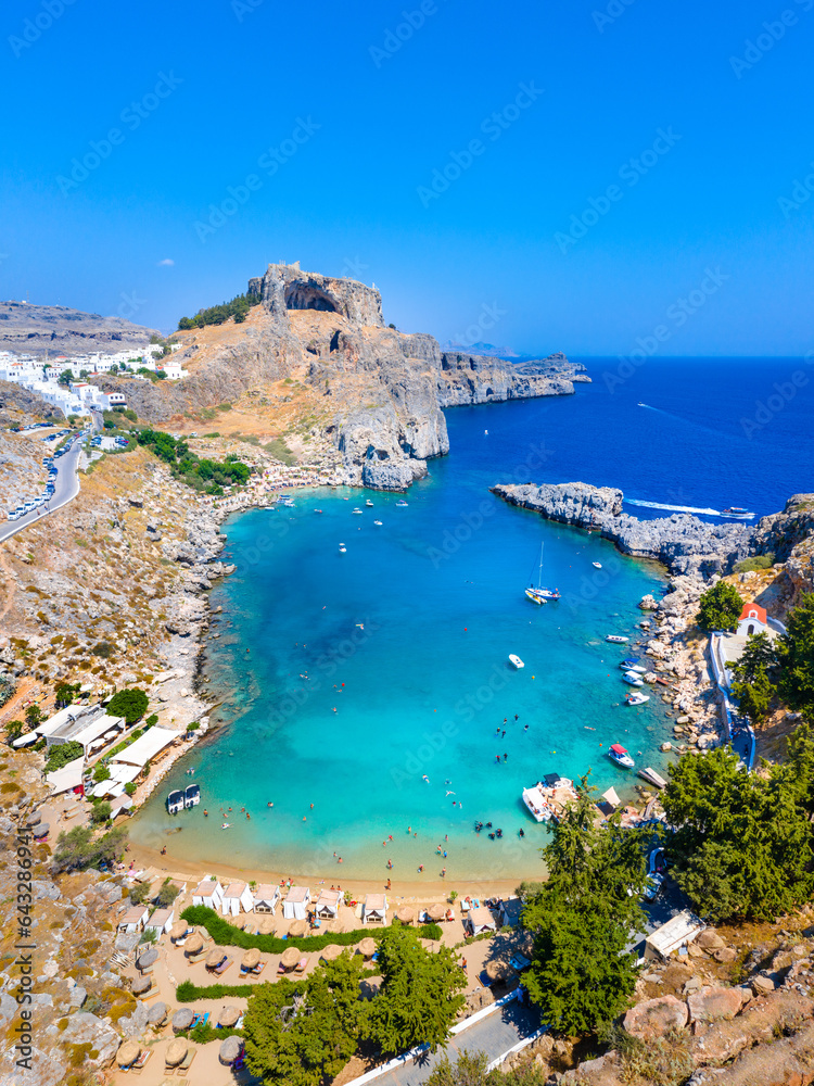 Panoramic view of St. Paul bay with acropolis of Lindos in background, Rhodes island, Greece