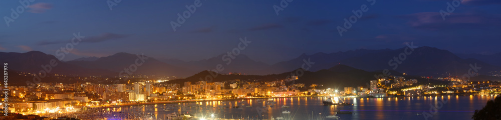 The houses of Ajaccio city and its marina at night , France, Corsica island.