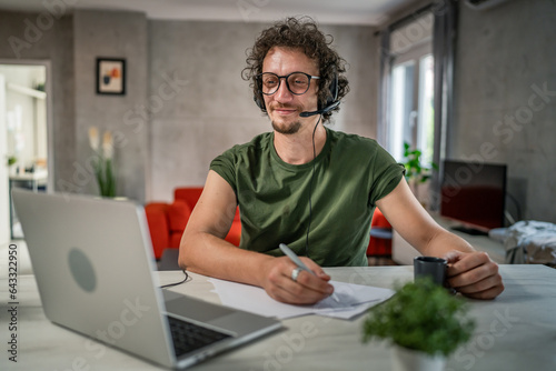 One man caucasian male freelancer work from home on laptop computer