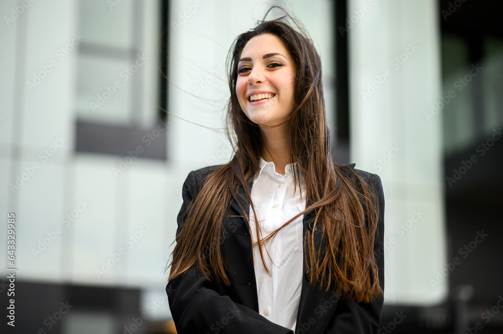 Confident young female manager outdoor in a modern urban setting Confident young female manager outdoor in a modern urban setting
