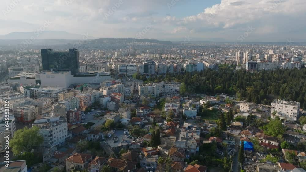 Aerial panoramic view of buildings in metropolis lit by last sun rays of day. Fly around modern high rise shopping centre. Antalya, Turkey Aerial panoramic view of buildings in metropolis lit by last sun rays of day. Fly around modern high rise shopping centre. Antalya, Turkey