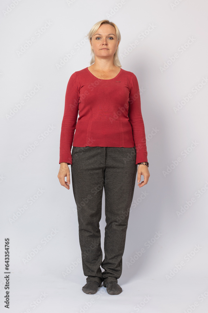 Image of a middle-aged woman on a gray background, front view.