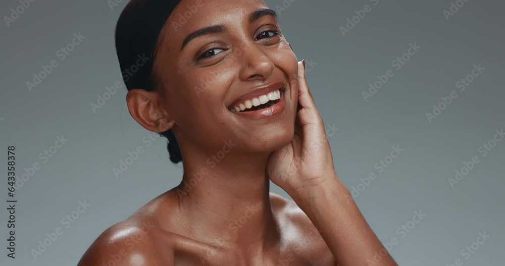 Skincare, face touch and beauty of woman in studio isolated on a gray background. Portrait, natural cosmetics and hand of happy model in facial treatment for health, wellness and manicure aesthetic Skincare, face touch and beauty of woman in studio isolated on a gray background. Portrait, natural cosmetics and hand of happy model in facial treatment for health, wellness and manicure aesthetic