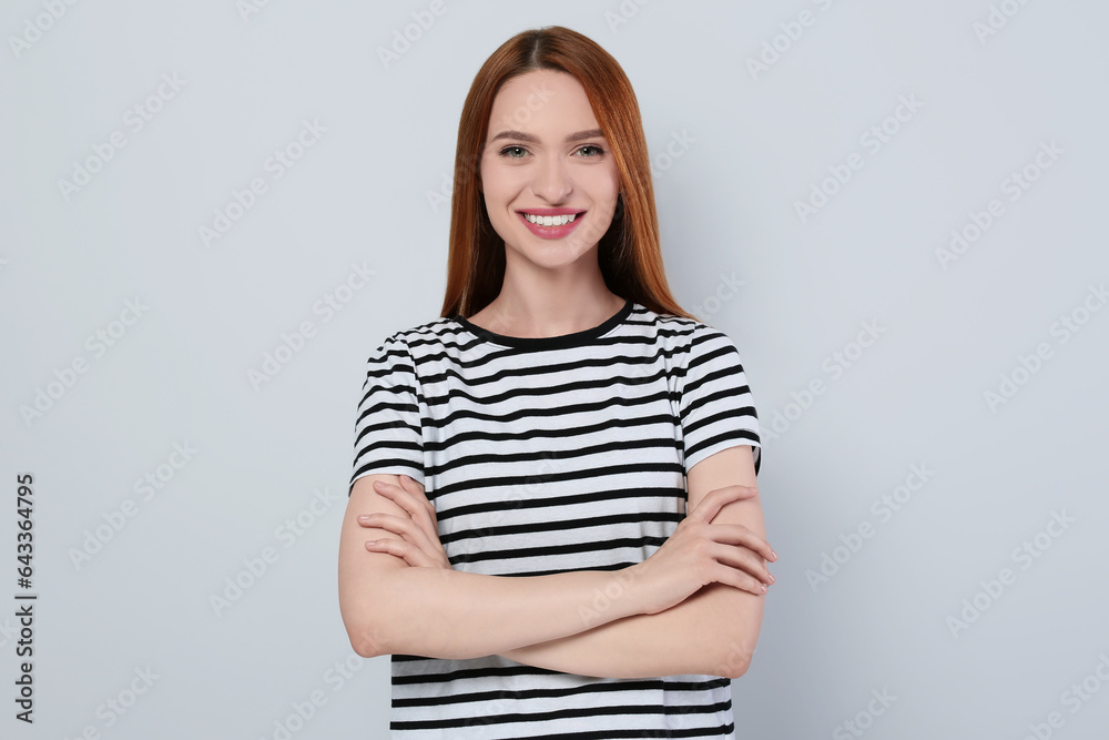 Portrait of beautiful young woman on light gray background Portrait of beautiful young woman on light gray background