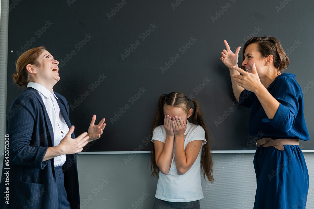 A female teacher and a student's mother yell at each other at the ...