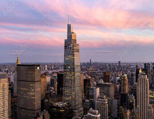 Fototapeta Naklejka Na Ścianę i Meble -  Aerial View of One Vanderbilt Met Life Building NYC Skyline with pink skies and clouds.