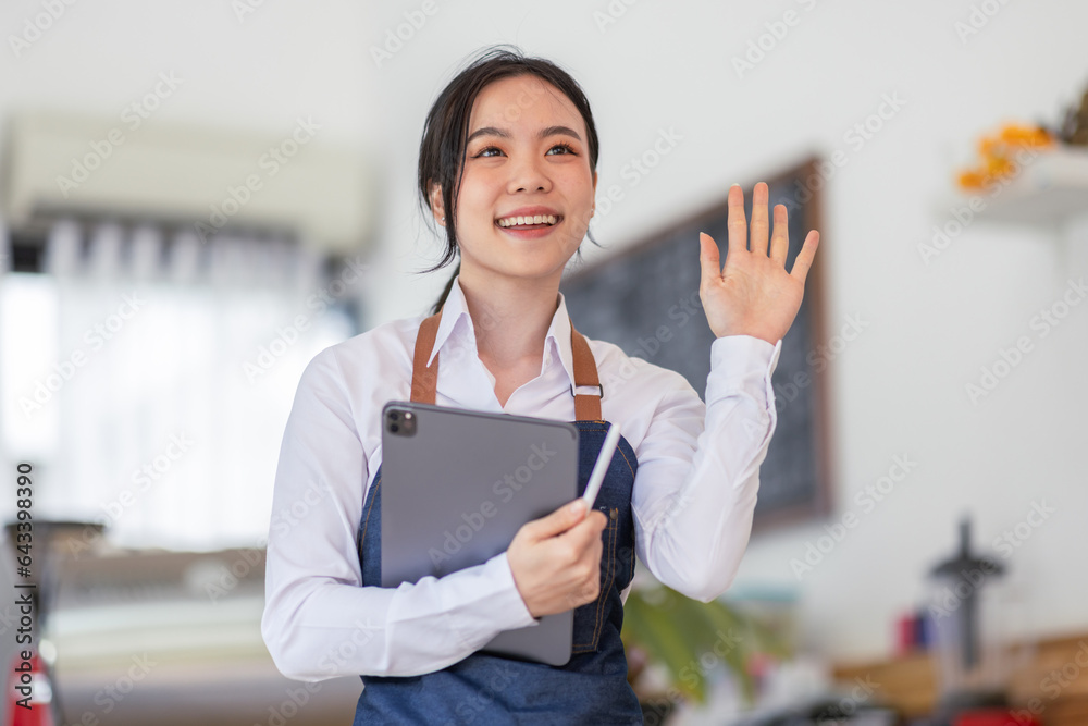 Portrait of young Happy asian business woman cafe owner in an apron with tablet, Asian CAFE Small business concept,