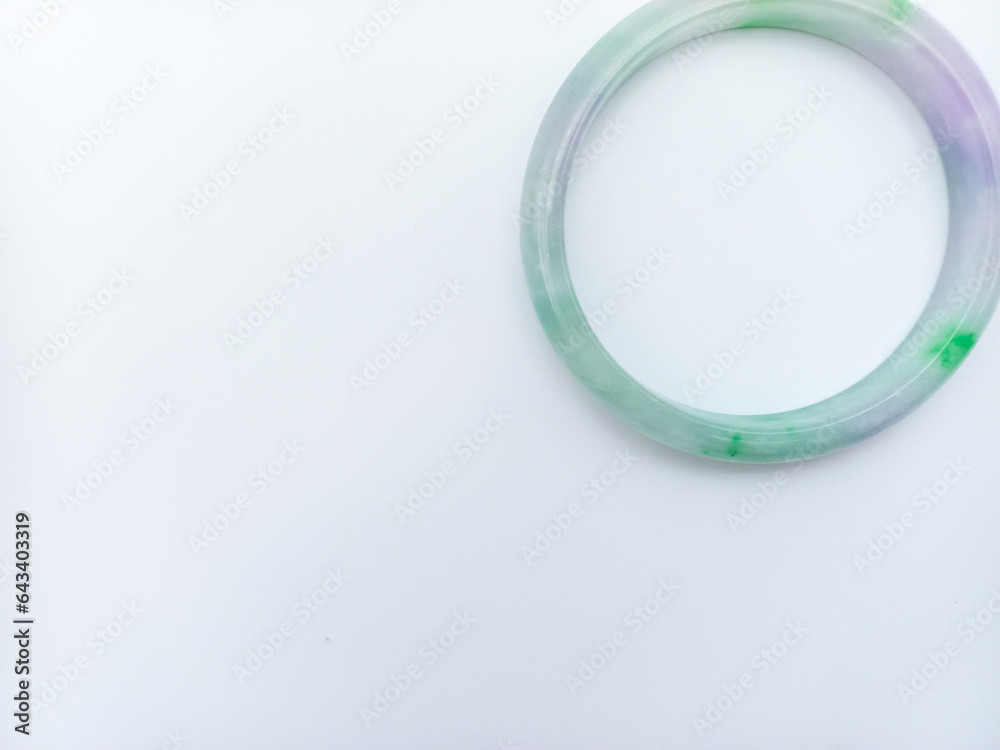 Light green And Purple Color Combination Jade Bracelet Isolated On White Background. Upper Corner Position With Negative Space Light green And Purple Color Combination Jade Bracelet Isolated On White Background. Upper Corner Position With Negative Space