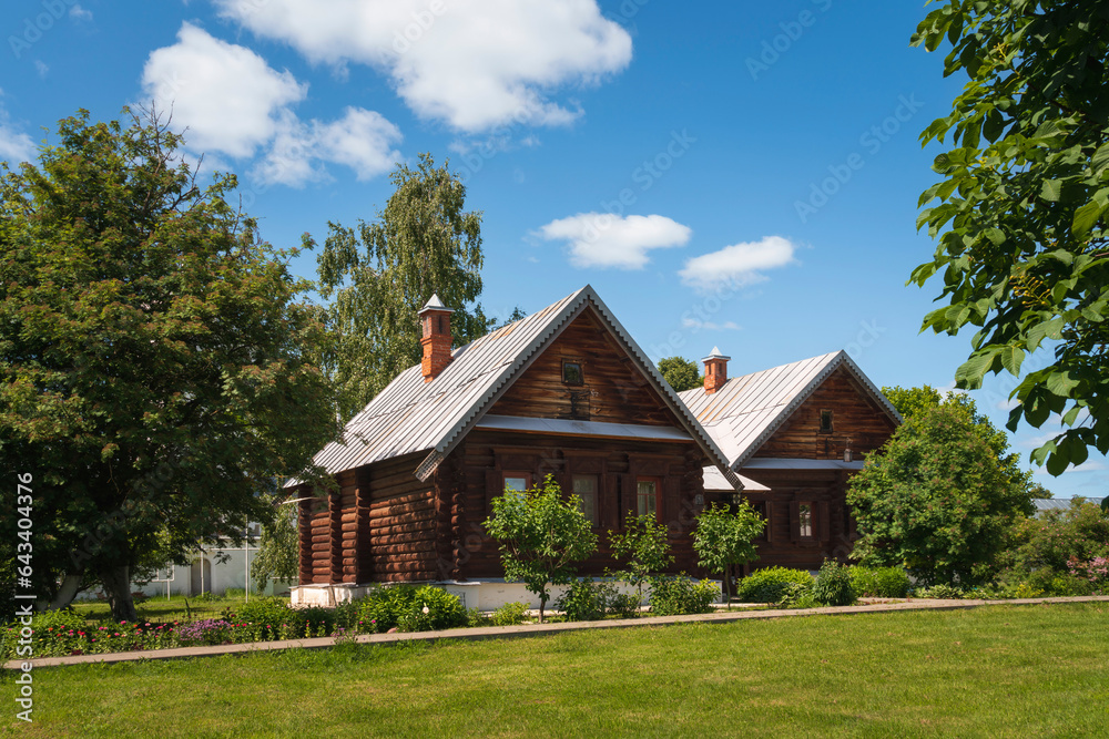 View of wooden residential buildings on the territory of the Holy Intercession Convent on a sunny summer day, Suzdal, Vladimir region, Russia