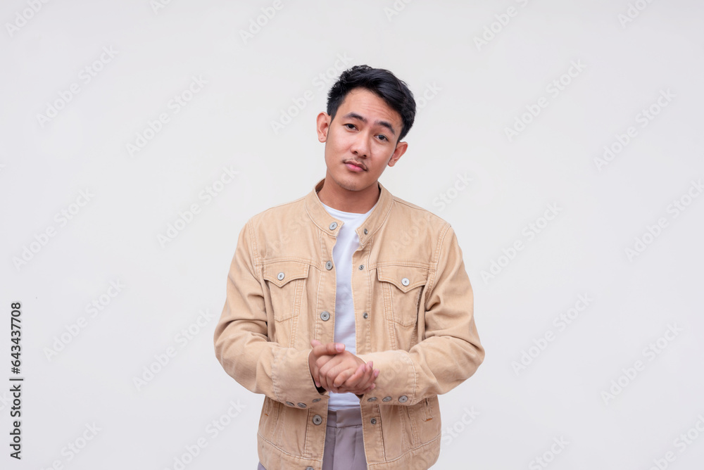 A handsome FIlipino guy explaining his proposal, making a sales pitch. Convincing someone to invest. Wearing a khaki jacket and white shirt. Isolated on a white background. A handsome FIlipino guy explaining his proposal, making a sales pitch. Convincing someone to invest. Wearing a khaki jacket and white shirt. Isolated on a white background.