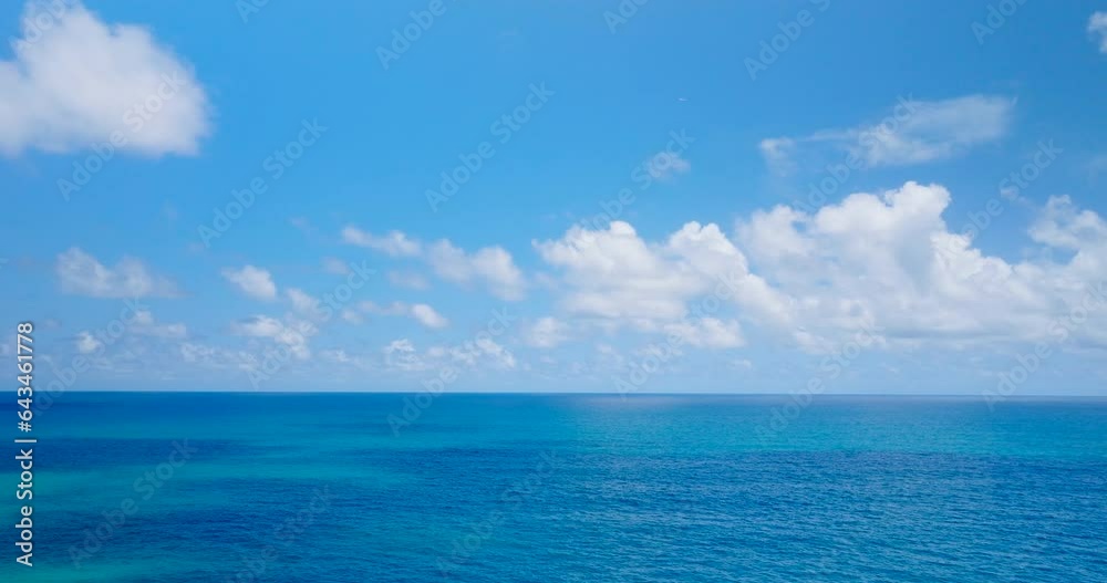 Aerial sea nature video beautiful blue sea, horizon as far as the eye can see, blue sky, beautiful white clouds, straight plane horizon, Filmed with high quality film cameras. DCI 4K ProRes422 Aerial sea nature video beautiful blue sea, horizon as far as the eye can see, blue sky, beautiful white clouds, straight plane horizon, Filmed with high quality film cameras. DCI 4K ProRes422