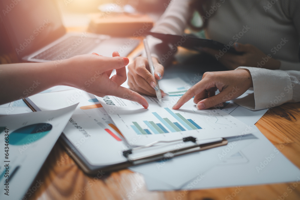 Group of business people analysis summary graph reports of business operating expenses and work data about the company's financial statements. Group of business people analysis summary graph reports of business operating expenses and work data about the company's financial statements.