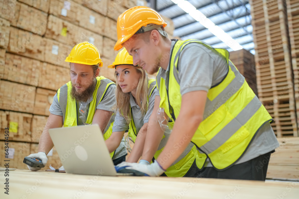 Warehouse worker working at lumber yard in Large Warehouse. Worker are Inventory check at Storage shelves in lumberyard. Warehouse worker working at lumber yard in Large Warehouse. Worker are Inventory check at Storage shelves in lumberyard.