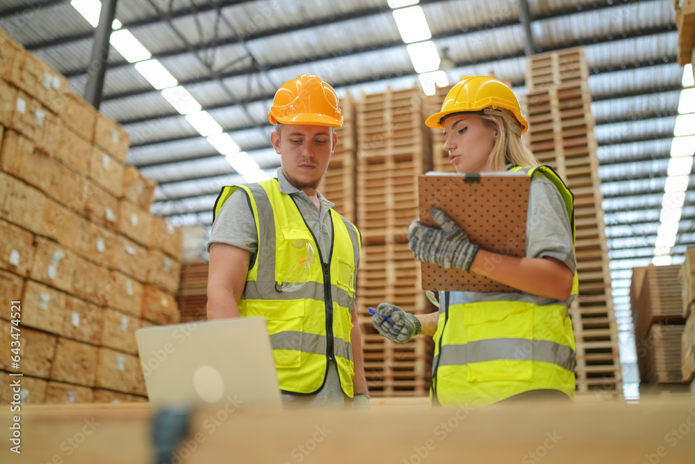 Woman with checklist in a timber and lumber warehouse. Product acceptance and quality control Woman with checklist in a timber and lumber warehouse. Product acceptance and quality control