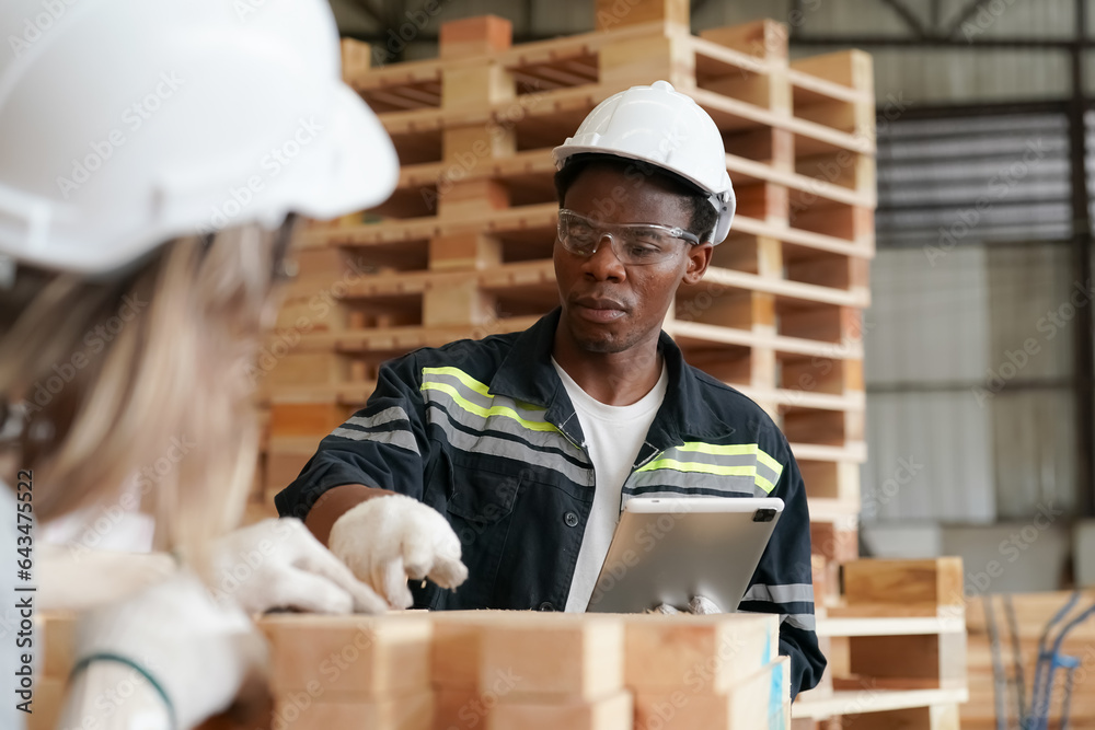 Industrial factory employee working in wooden manufacturing industry Industrial factory employee working in wooden manufacturing industry