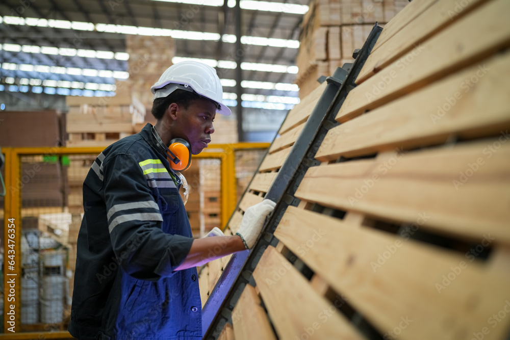 Industrial factory employee working in wooden manufacturing industry