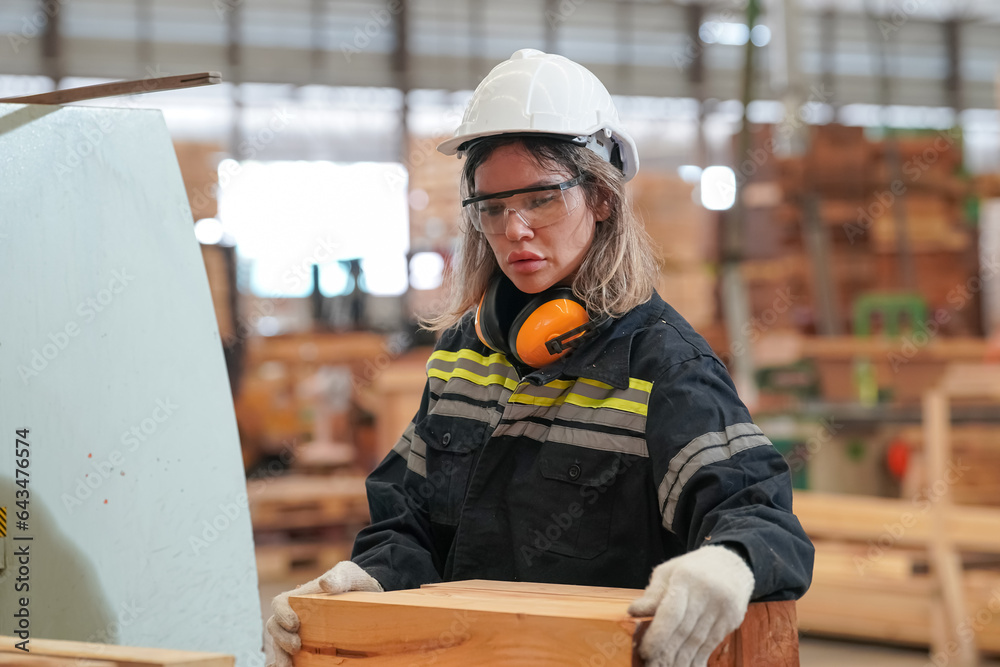 Worker are working at lumber yard in Large Warehouse. Worker are  working.on woodworking machine, lumber and Inventory check at Storage shelves in lumberyard.